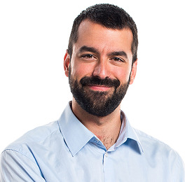 A smiling drak-haired man with beard